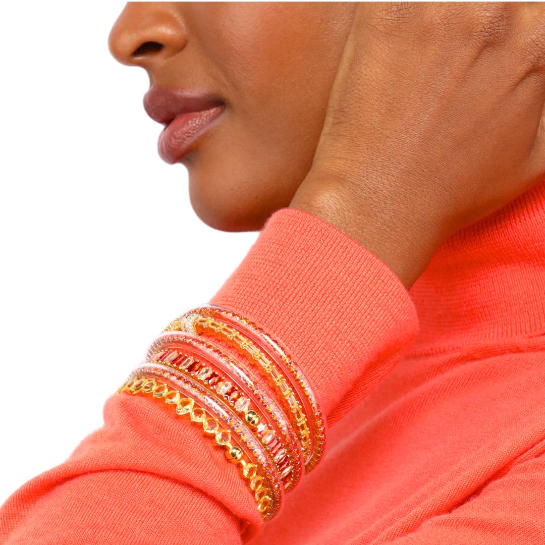 Orange Spark Collection Luxury Bracelets on Model Wearing Orange Turtleneck | BuDhaGirl